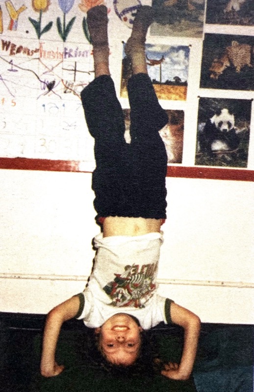 child standing on his hands